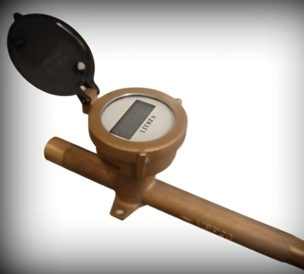 Brass water flow meter with digital readout.